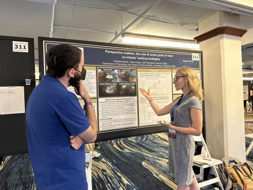 Christian presenting her poster at the VSS conference in May 2023